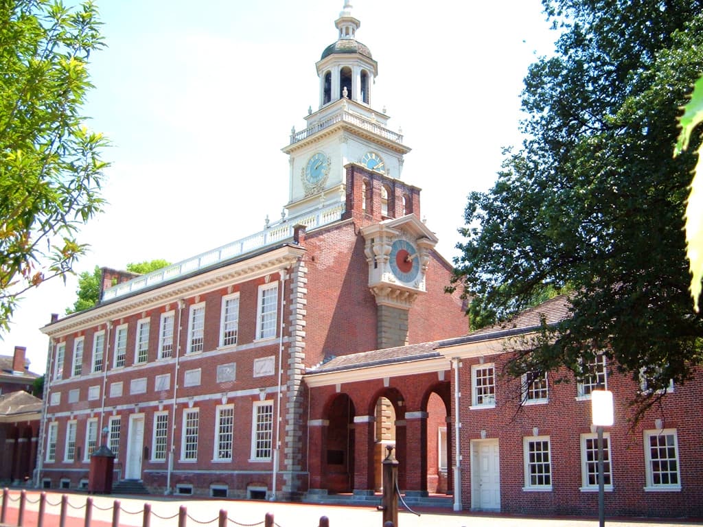 Independence Hall in Old City, Philadelphia — the brick tower and clock at sunset