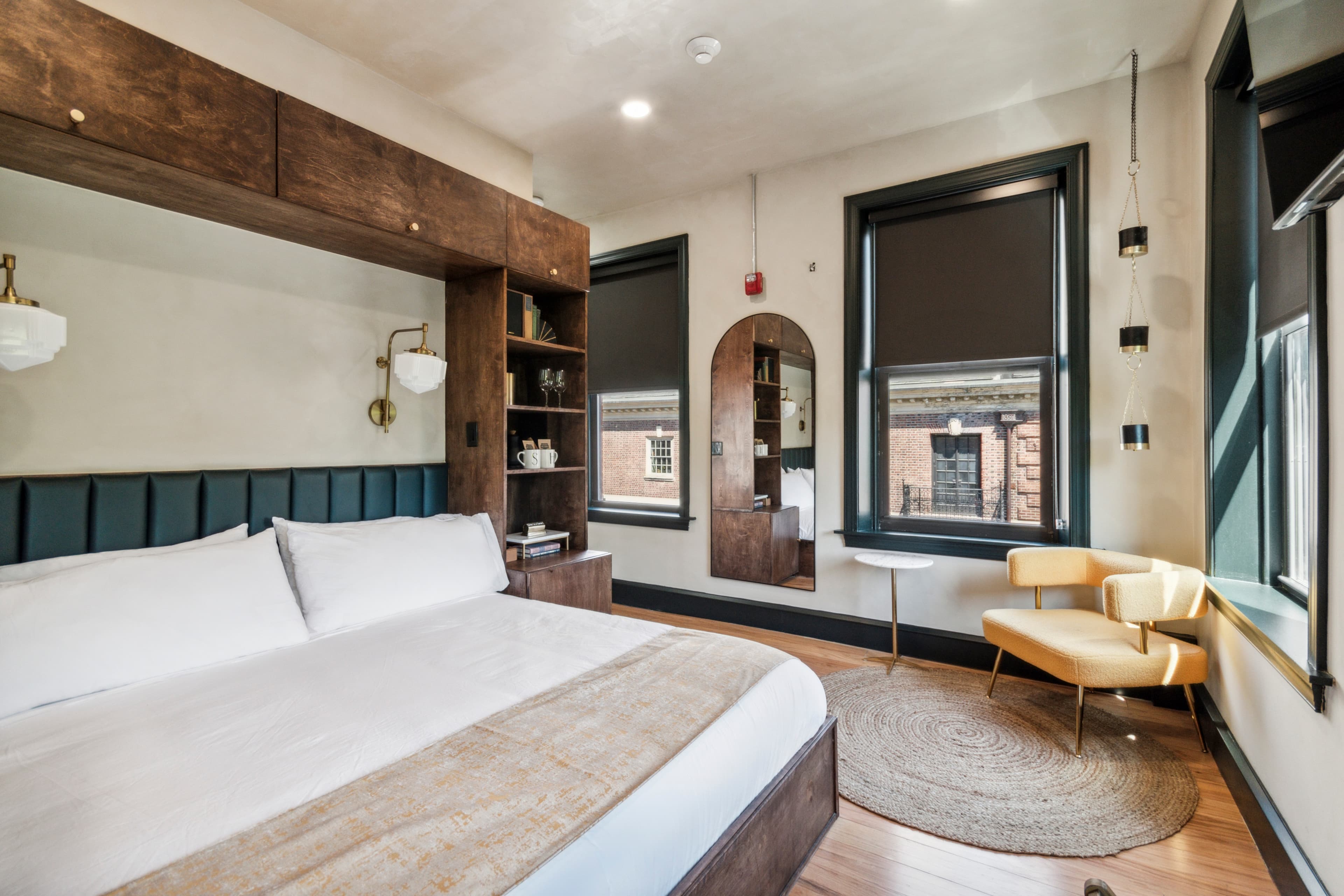 King room — bed, arched mirror, window light